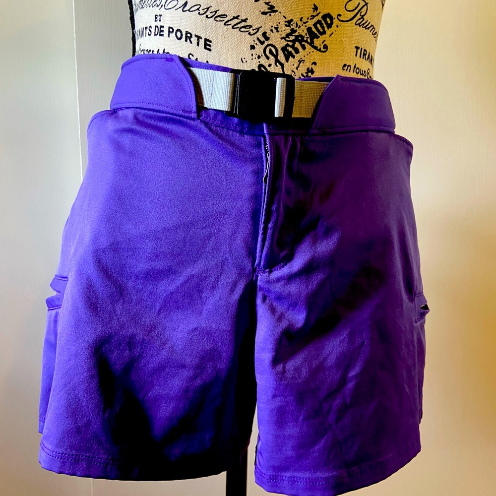 Under armor golf shorts. These are very vibrant purple size 12 and so so cute